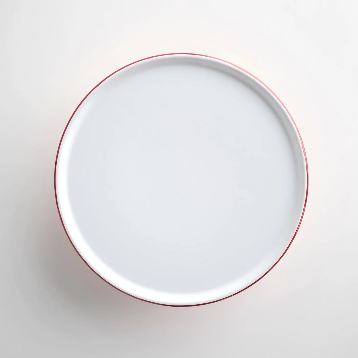 Falcon Enamel Cake Stand In pillarbox red with heavyweight steel construction and thick enamel coating, perfect for displaying cakes and desserts.