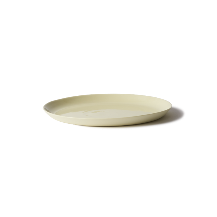 Handmade Traditional Charger Plate in porcelain, perfect for serving cakes or as a multi-use platter. Features smooth stone-like exterior and clear glazed interior.