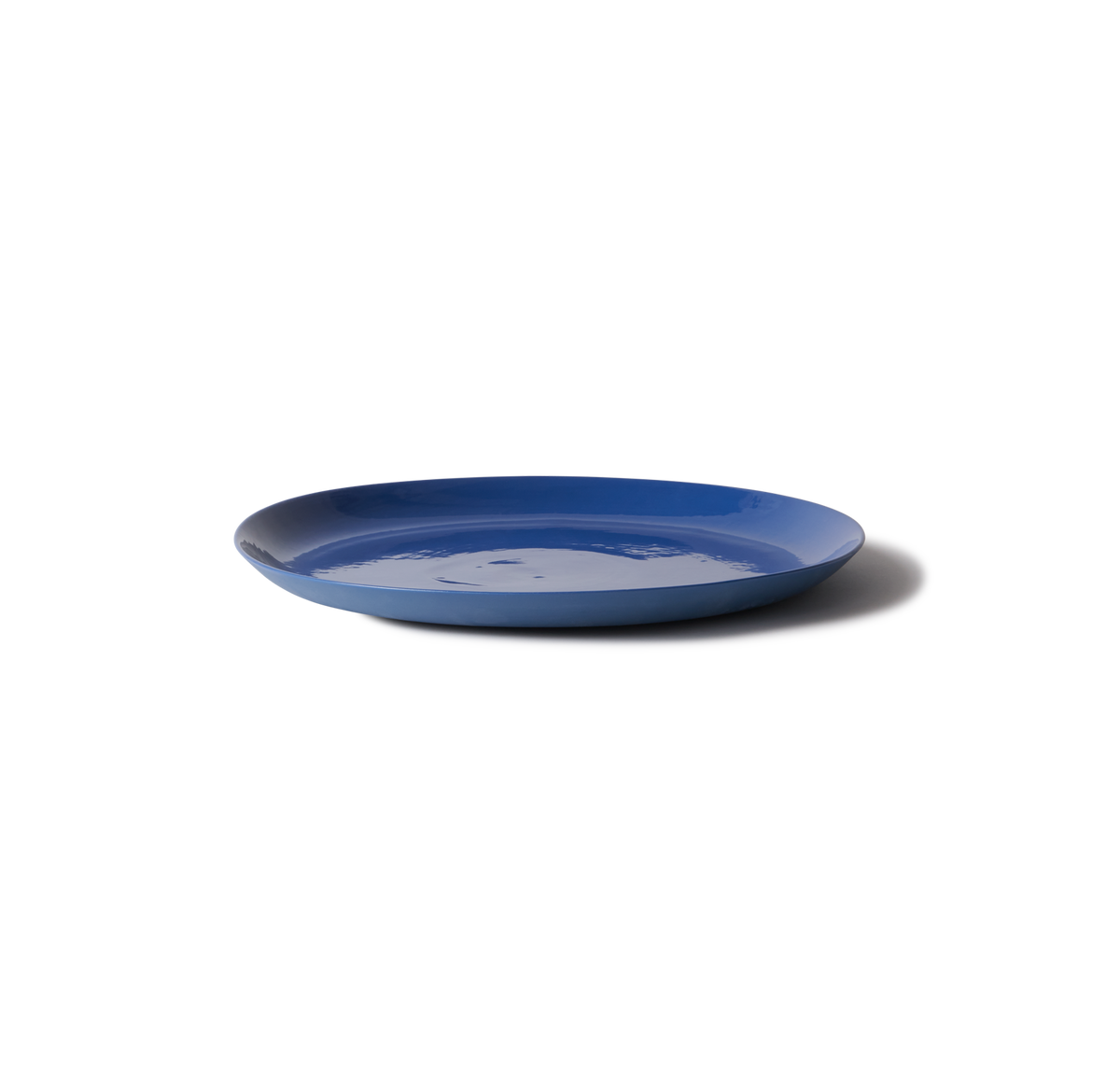 Handmade Traditional Charger Plate in porcelain, perfect for serving cakes or as a multi-use platter. Features smooth stone-like exterior and clear glazed interior.