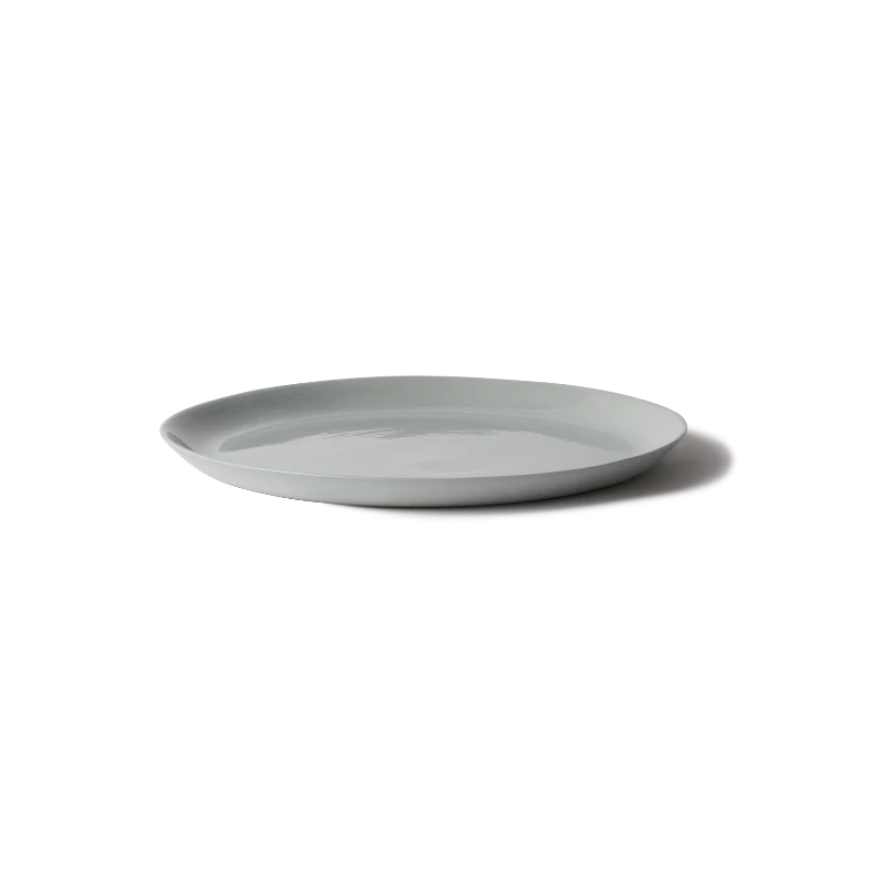 Handmade Traditional Charger Plate in porcelain, perfect for serving cakes or as a multi-use platter. Features smooth stone-like exterior and clear glazed interior.