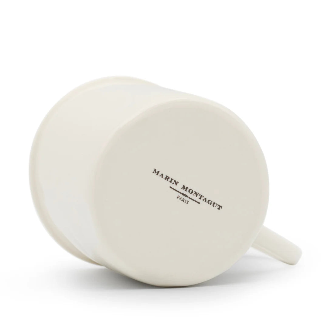 Bottom view of the Crowned Heart Mug by Marin Montagut, emphasizing its shape and fine porcelain material.