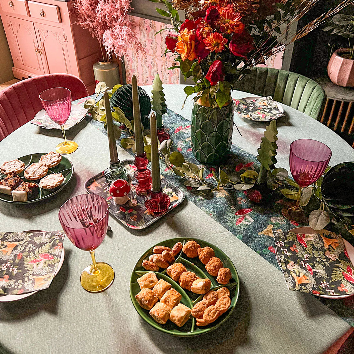 Elegant burgundy red glass candlestick holder with a unique three-tier design, standing 5 inches tall, perfect for straight or spiral candles and adding a sophisticated touch to any space or holiday décor.