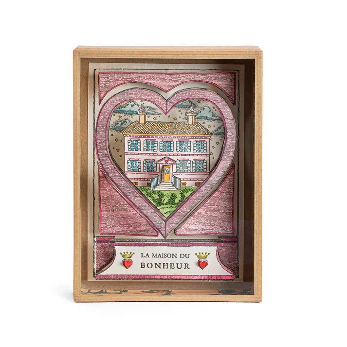 "Hand-painted House of Happiness Shadow Box by Marin Montagut, featuring a whimsical house design inside a glass-enclosed papier-mâché display, handcrafted in Paris. Dimensions: 8.86x6.5x1.77 inches."