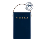 FIELDBAR Drinks Box hardcase cooler with leather handle and brass-coated hardware, showcasing its sleek design and Pantone 10C color, placed on an outdoor surface. Drinks Box / Sea Boat Blue