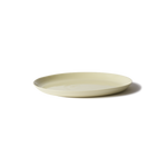 Handmade Traditional Charger Plate in porcelain, perfect for serving cakes or as a multi-use platter. Features smooth stone-like exterior and clear glazed interior.
