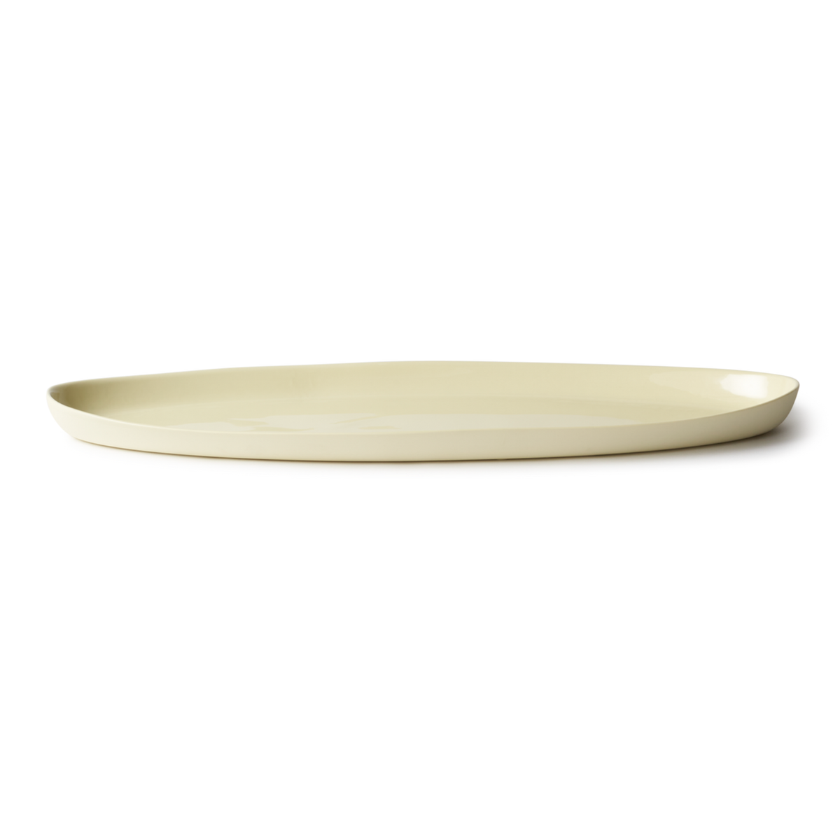 Handmade Oval Shaped Fish Platter in porcelain, designed for serving fish, snacks, or dips. Features a smooth, stone-like exterior and clear glazed interior.