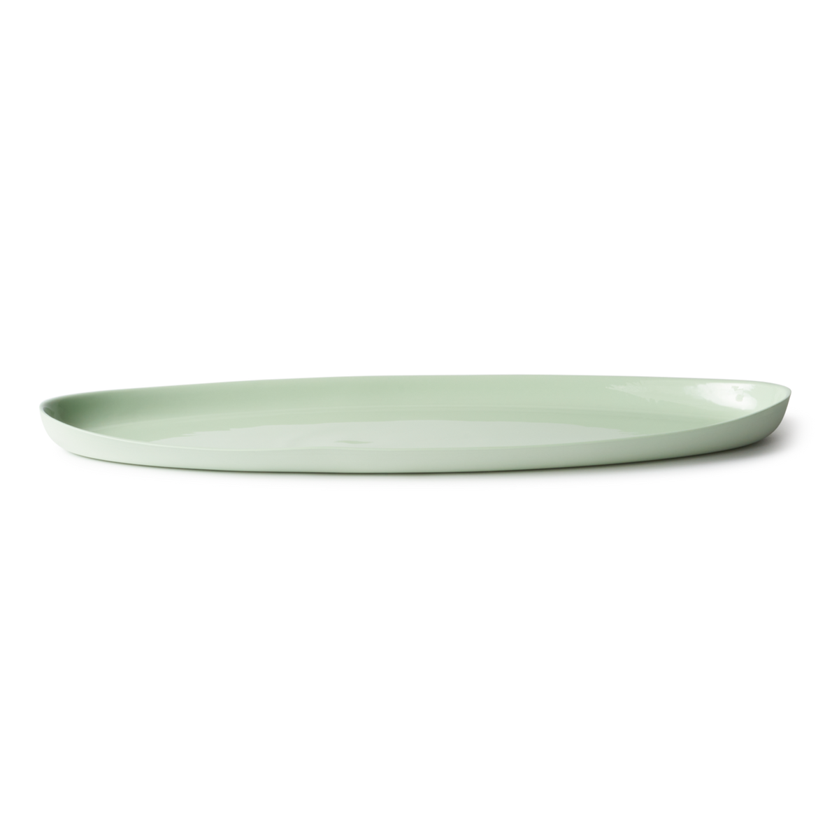 Handmade Oval Shaped Fish Platter in porcelain, designed for serving fish, snacks, or dips. Features a smooth, stone-like exterior and clear glazed interior.