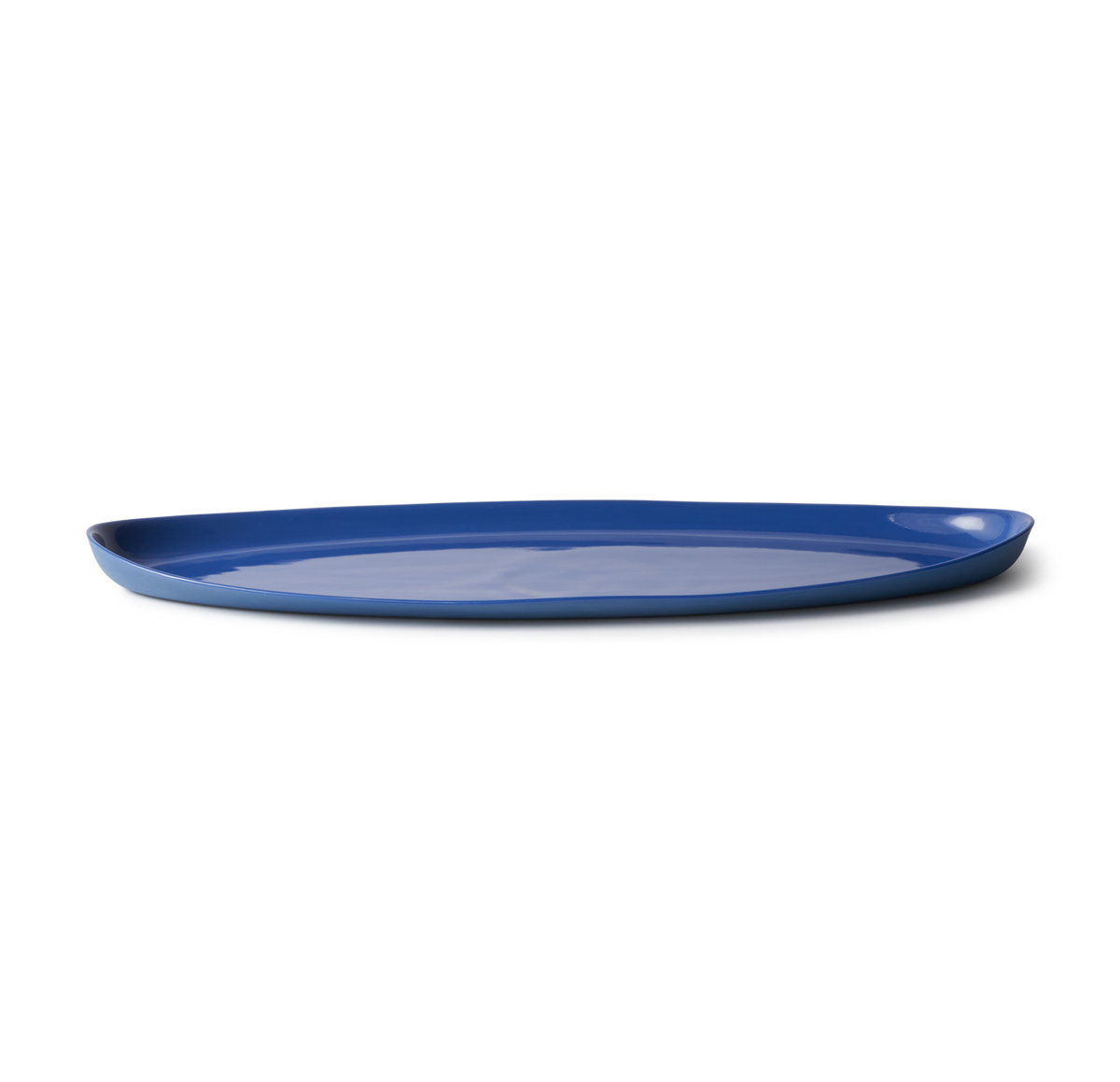 Handmade Oval Shaped Fish Platter in porcelain, designed for serving fish, snacks, or dips. Features a smooth, stone-like exterior and clear glazed interior.