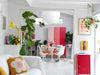 Modern living room with white sofa, colorful cushions, and a red locker.