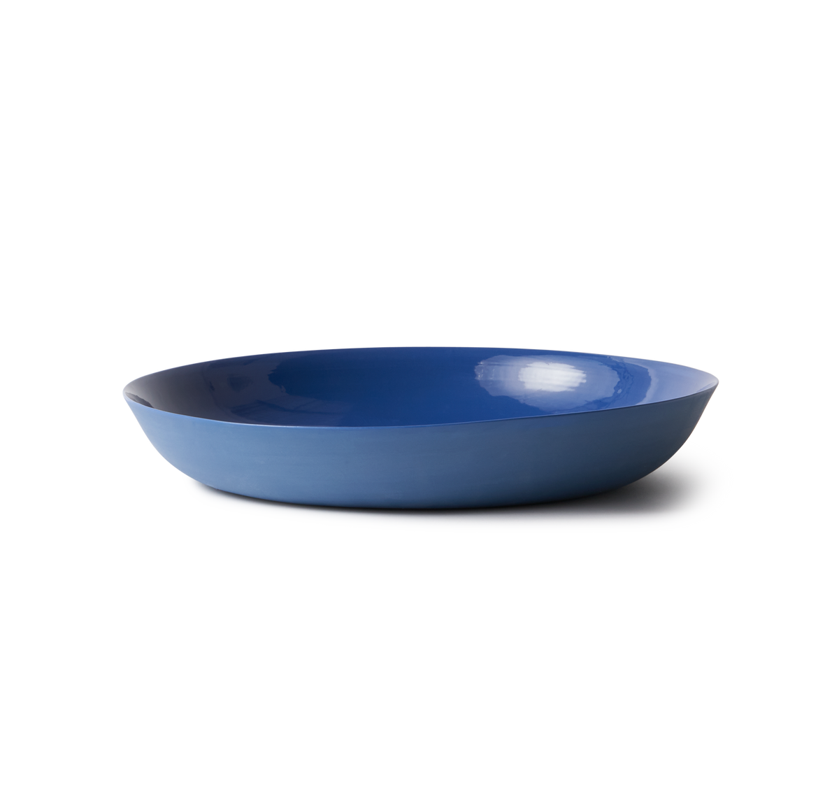 Handmade Pebble Bowl Large - Ink in porcelain, perfect for serving or display. Features a smooth stone-like exterior and clear glazed interior.