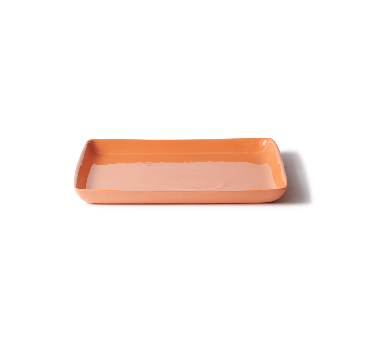 Handmade orange porcelain large square platter, perfect for serving roast vegetables, charcuterie, or Pavlova, with a smooth, stone-like exterior.