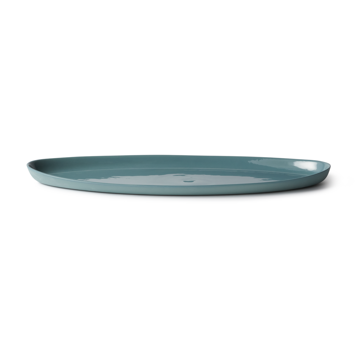 Handmade Oval Shaped Fish Platter in porcelain, designed for serving fish, snacks, or dips. Features a smooth, stone-like exterior and clear glazed interior.