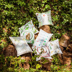 The French Cushion: Luxembourg Garden&nbsp;by Marin Montagut brings a whimsical touch to your home with its charming design. Featuring an illustration by Marin Montagut, this cushion adds a playful element to any space. Pink velvet back and tassle