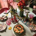 Elegant burgundy red glass candlestick holder with a unique three-tier design, standing 5 inches tall, perfect for straight or spiral candles and adding a sophisticated touch to any space or holiday décor.