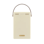 FIELDBAR Drinks Box hardcase cooler with leather handle and brass-coated hardware, showcasing its sleek design and Pantone 10C color, placed on an outdoor surface. Drinks Box / Safari White