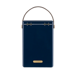 FIELDBAR Drinks Box hardcase cooler with leather handle and brass-coated hardware, showcasing its sleek design and Pantone 10C color, placed on an outdoor surface. Drinks Box / Sea Boat Blue